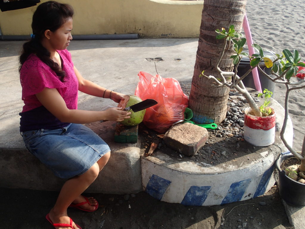 Lovina beach Bali coconut cutting